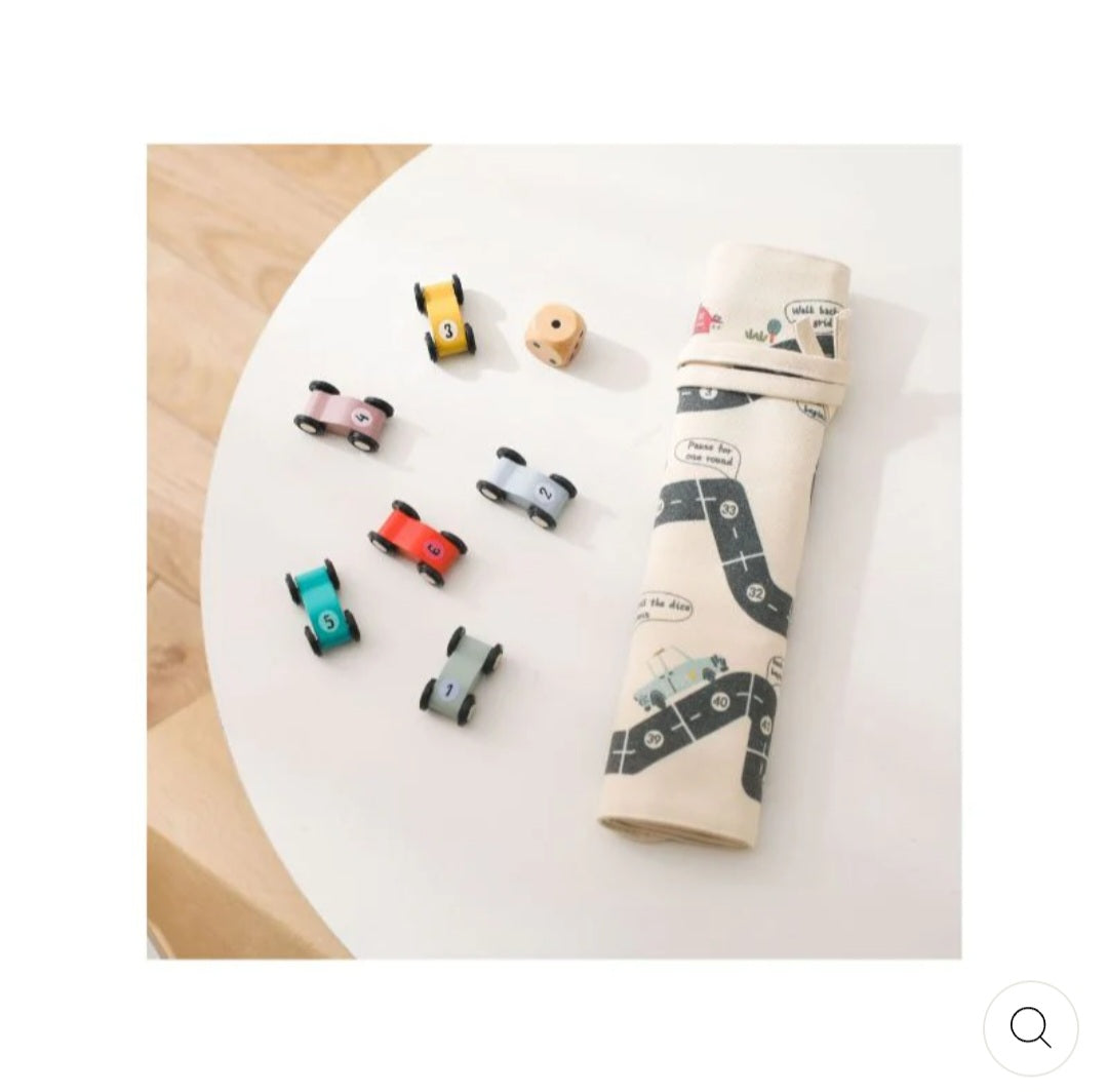 Double-sided, roll-up, canvas playmat with wooden cars.