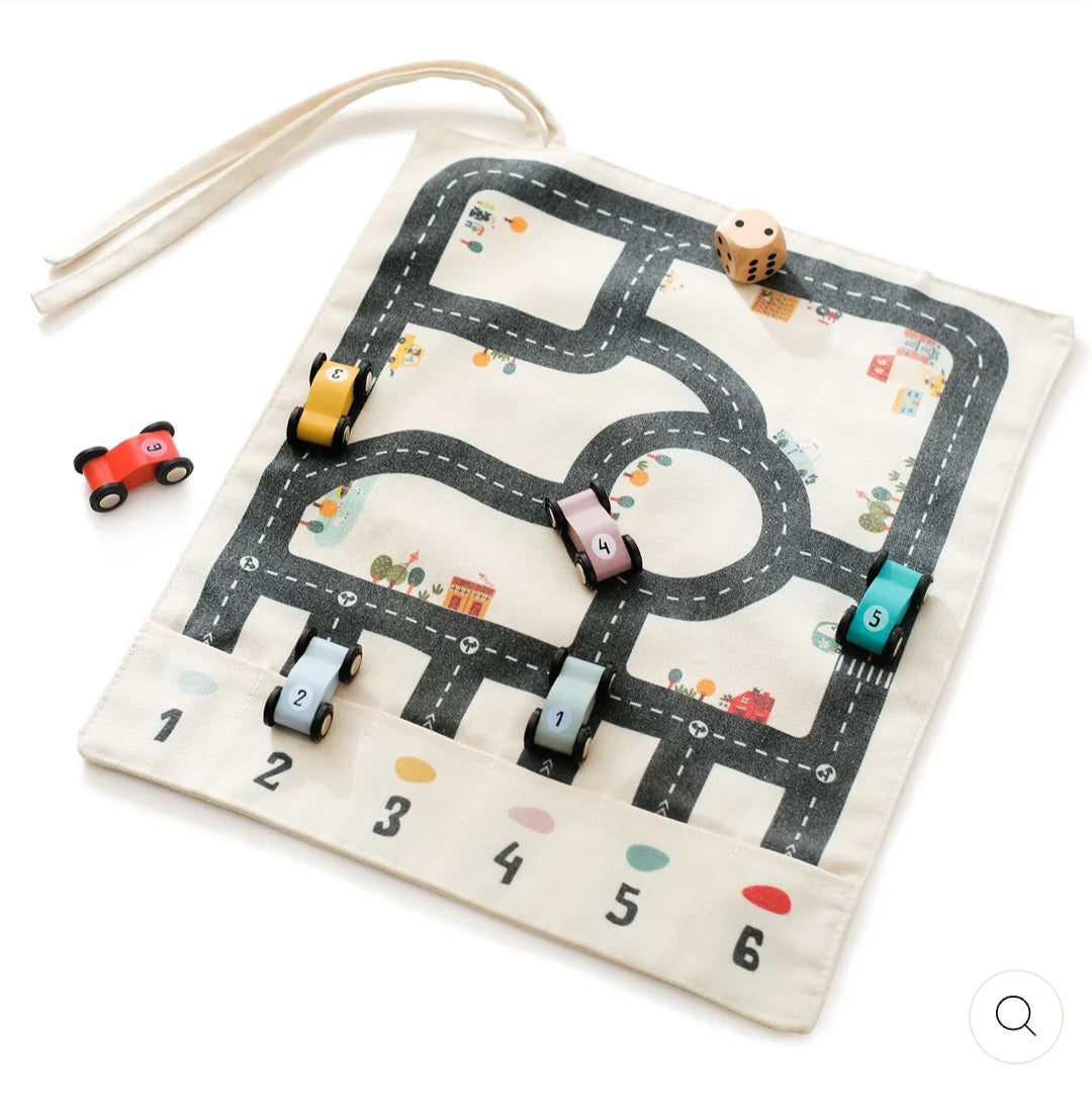 Double-sided, roll-up, canvas playmat with wooden cars.