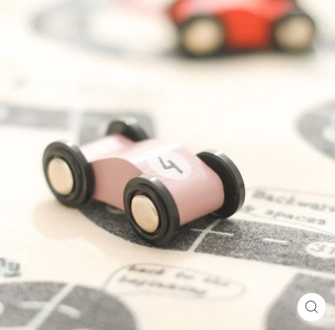 Double-sided, roll-up, canvas playmat with wooden cars.